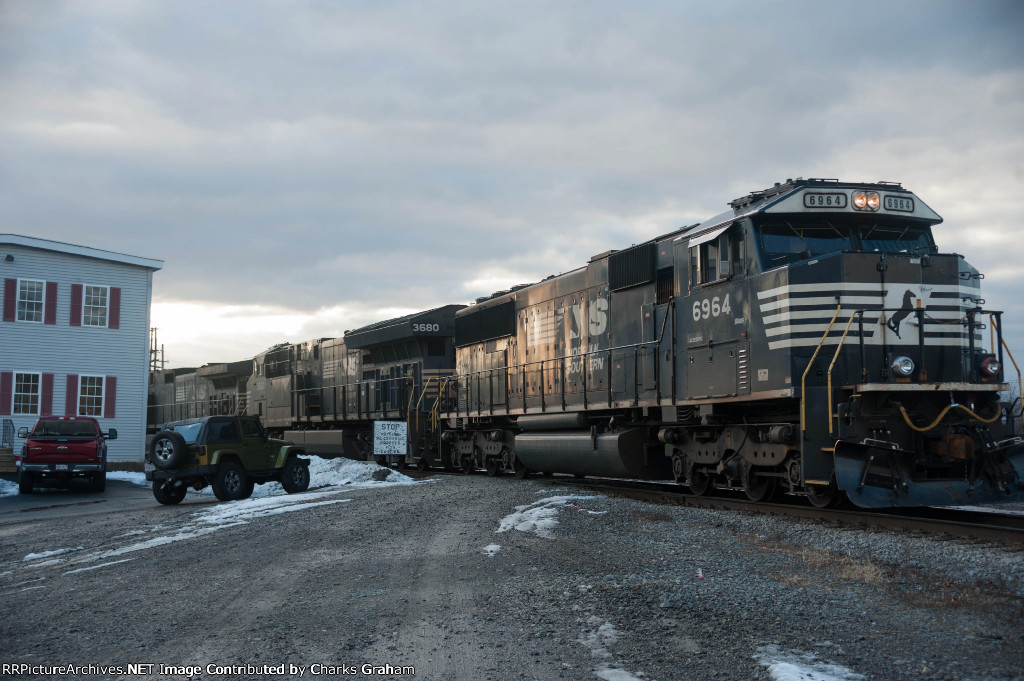 NS 6964 backing up in the setting sun.